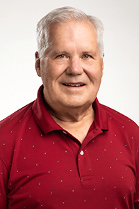 Dr. Kevin Horner wearing a red polo with white dots at Horner Barrow Orthodontics, PC.